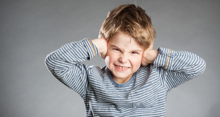 kid-covering-ears